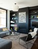 Modern home with Living Room, Sectional, Pendant Lighting, Medium Hardwood Floor, and Gas Burning Fireplace. the family room with fireplace wall and shelving painted almost-black Photo 6 of Glen Park House