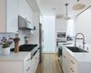 Modern home with Kitchen. kitchen with glass enclosed skylight shaft at the end Photo 7 of Bridge House