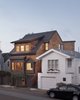 Modern home with Exterior, Wood Siding Material, Gable RoofLine, House, and Tile Roof Material. shingle bungalow with modern addition Photo of Bungalow Update