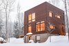 If you have any ideas please share.
I have designed and built this house.
The house has concrete floors to absorb solar energy from the south-facing windows.
I would like to add some shade on these windows.
In mid season, too much sun gets in the house.
Thanks! Photo 6 of Cubic house in the Laurentian forest modern home