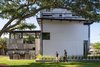 Modern home with Outdoor, Grass, Side Yard, and Trees. Each exterior panel is a custom graffiti mural by local artist Bask Hostomsky. These panels comprise multiple layers of paint and pattern that bring textured accents to the home. Photo 3 of 400SOLA