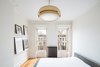 Modern home with Bedroom, Pendant Lighting, Accent Lighting, Bed, and Medium Hardwood Floor. Masterbedroom Photo 11 of Brooklyn Brownstone