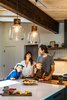 Modern home with Kitchen, Porcelain Tile Backsplashe, Wood Cabinet, Colorful Cabinet, Ceramic Tile Backsplashe, Ceiling Lighting, and Pendant Lighting. As seen in Boulder Lifestyle Magazine Photo 6 of Boulder Kitchen