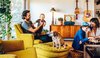 Modern home with Living Room, Coffee Tables, Chair, Light Hardwood Floor, Ottomans, and Table Lighting. As seen in Boulder Lifestyle Magazine Photo 5 of Boulder Kitchen
