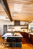 Modern home with Kitchen, Colorful Cabinet, Porcelain Tile Backsplashe, Undermount Sink, Pendant Lighting, Wood Cabinet, Range Hood, Ceramic Tile Backsplashe, Range, Ceiling Lighting, and Light Hardwood Floor. As seen in Boulder Lifestyle Magazine Photo 9 of Boulder Kitchen