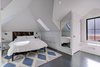 Modern home with Bedroom, Recessed Lighting, Night Stands, Ceiling Lighting, Dark Hardwood Floor, and Bed. The master bedroom, with shaker drawer fronts painted white. Photo 15 of Denver Home
