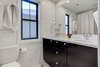 Modern home with Bath Room, Subway Tile Wall, Undermount Sink, One Piece Toilet, Ceramic Tile Floor, Marble Counter, Ceramic Tile Wall, Recessed Lighting, and Ceiling Lighting. This bathroom uses our DIY shaker, painted black. Photo 13 of Denver Home