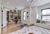 Modern home with Kids Room, Toddler Age, Playroom Room Type, Pre-Teen Age, Family Room Room Type, Medium Hardwood Floor, Bookcase, Storage, Light Hardwood Floor, and Neutral Gender. The family room. Photo 11 of Denver Home