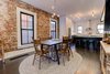 Modern home with Dining Room, Recessed Lighting, Chair, Table, Pendant Lighting, Storage, Ceiling Lighting, Stools, Bar, and Dark Hardwood Floor. Here, you can make out the doors installed underneath the breakfast bar for additional storage. Photo 8 of Denver Home