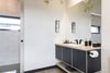 Modern home with Bath Room, Concrete Floor, Laminate Counter, and Drop In Sink. Ensuite Photo 11 of The Golf Course House
