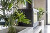 Modern home with Living Room, Concrete Floor, Wood Burning Fireplace, Two-Sided Fireplace, and Bench. Fireplace Photo 8 of The Golf Course House