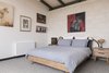 Modern home with Bedroom, Ceiling Lighting, Bed, Pendant Lighting, Night Stands, and Carpet Floor. Master Bedroom Photo 10 of The Golf Course House