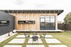 Modern home with Outdoor, Pavers Patio, Porch, Deck, Side Yard, Grass, Concrete Patio, Porch, Deck, and Vertical Fences, Wall. Courtyard Photo 15 of The Golf Course House