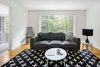 Modern home with Living Room, Sofa, End Tables, Coffee Tables, Lamps, Chair, Ceiling Lighting, and Medium Hardwood Floor. The Downstairs at The Bracy House Photo 2 of The Bracy House