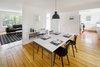 Modern home with Dining Room, Chair, Table, Pendant Lighting, Medium Hardwood Floor, and Storage. The Downstairs at The Bracy House Photo 3 of The Bracy House