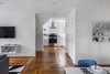 Modern home with Kitchen, Range, Range Hood, Microwave, White Cabinet, Engineered Quartz Counter, Drop In Sink, Medium Hardwood Floor, and Ceiling Lighting. The Upstairs at The Bracy House Photo 9 of The Bracy House