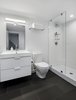 Modern home with Bath Room, Ceramic Tile Floor, Open Shower, Wall Lighting, Ceramic Tile Wall, One Piece Toilet, and Ceiling Lighting. The Upstairs at The Bracy House Photo 11 of The Bracy House