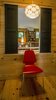 Modern home with Bedroom, Chair, Medium Hardwood Floor, and Pendant Lighting. Views and daylight from one side of the house to the other Photo 6 of Basecamp Home