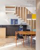 Modern home with Dining Room, Chair, Table, Bar, Pendant Lighting, Light Hardwood Floor, and Medium Hardwood Floor. Kitchen and dining area from point of entry with coffee and drink service beyond Photo 3 of House Grace