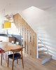 Modern home with Dining Room, Chair, Table, Pendant Lighting, Light Hardwood Floor, and Medium Hardwood Floor. Dining and staircase to second floor Photo 9 of House Grace