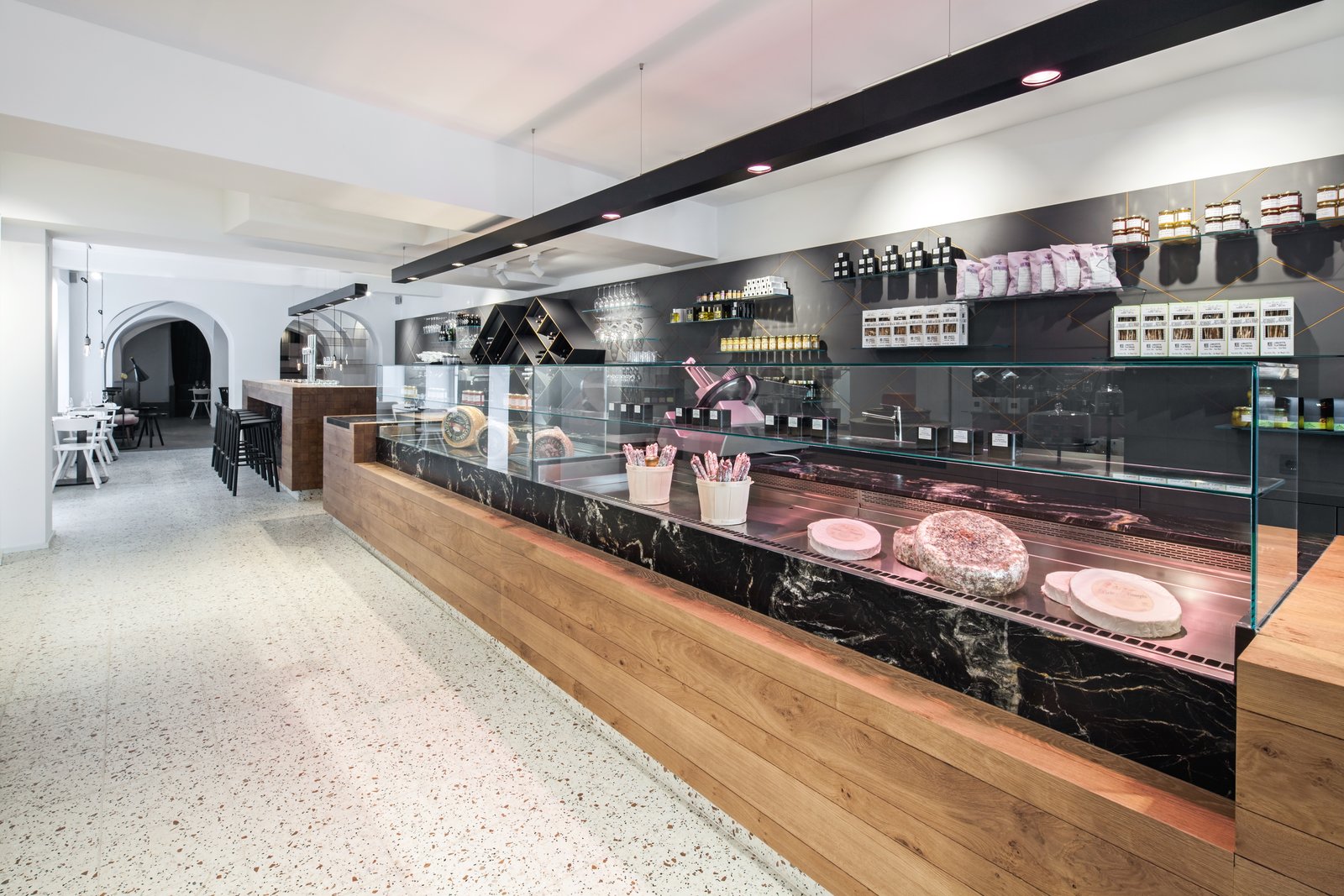 The oak counters and bars evoke images of wooden beams, which were inspired by the building’s original structure.  Photo by Monika Nguyen.
                     