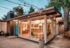 Clear panels of glass replace the original stile-and-rail wood windows, taking advantage of the house’s post-and-beam structure to make for a seamless connection between indoors and out. Photo 3 of Cliff May Homes RM 3212 modern home