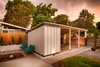 The house’s original post-and-beam carport includes a lockable storage shed and a new remote-controlled gate. Photo 6 of Cliff May Homes RM 3212 modern home