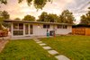 Behind the house is a large lawn, providing plenty of room for the couple’s dogs to play. Photo 8 of Cliff May Homes RM 3212 modern home