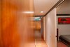 Wood paneling has been added to the narrow hallway that leads to the master suite. Photo 15 of Cliff May Homes RM 3212 modern home