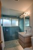 The renovated master bath. A tub has been removed to make room for a new glass shower. Photo 20 of Cliff May Homes RM 3212 modern home