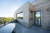 A rotated second floor plan, cladded with a beetle kill pine rainscreen, is design to optimize southern exposure while capturing flatiron views. Photo 8 of Sunset modern home