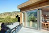 Zola Lift & Slide Door is an innovative solution for maximizing views using wide uninterrupted expanses of glass. These doors offer exceptionally high energy performance and superior operability. Available in the PanoramicView, Thermo Alu lines, Thermo Plus Clad, Thermo Clad, Thermo Wood and Thermo uPVC product lines. Photo 3 of Sunset modern home