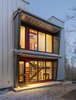 Elements such as solar design, triple pane Zola windows, energy efficient appliances, a rainwater catchment system that supplies all the water and healthier eco-friendly materials – repurposed bowling alley lanes for countertops and recycled wood used throughout – are just a few of the sustainable features incorporated into this innovative design approach. Photo 11 of Love Shack modern home