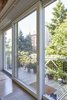 An expansive, Zola three-panel lift slide door spans nearly the entire width of the house, illuminating the whole floor. The rear facade is southern-facing, and the spacious dining room provides an ideal location for placement of this large opening.
http://www.zolawindows.com/thermoclad/ Photo 3 of Carroll Gardens Passive House modern home
