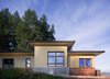 Zola’s Thermo Wood line, which boasts R-11 triple glazing and is thermally broken with a layer of patented German Purenit®, was selected for this project. Natural daylight enters both from the Zola tilt & turn and fixed windows in the living and dining areas, and through the terrace door that leads seamlessly outside
to the natural landscape. Photo 5 of Prairie Passive modern home