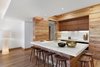 The custom open kitchen pairs strips of reclaimed wood and marble sourced locally from Vermont Danby Marble. Photo 11 of An Historic TriBeCa Building Reborn modern home