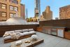 Outdoor deck features Zola Lift & Slide Door offering outstanding thermal and acoustic performance while showcasing expansive views of downtown Manhattan. Photo 15 of An Historic TriBeCa Building Reborn modern home