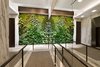 Another striking component of the project is the Biophilia and the use of nature to improve the building’s living conditions. Featuring a planted living green wall in the lobby, which offers aesthetic charm while contributing to a healthy and natural ventilation system. These materials help execute the vision of excellence, sustainability, and historic preservation – choosing to honor the past while building for the future. Photo 7 of An Historic TriBeCa Building Reborn modern home