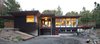 Nestled in a wooded area in the Pacific Northwest, the 1800 sf Passive Cedar Haus was built as a retirement home. The Artisans Group designed the layout of the home, mindful of aging in place, and working to ensure that the home blended in with the surrounding natural beauty. The project meets a complex program, with an unheated sleeping porch for a master bedroom, a screened porch, a 600 sf caretakers apartment/mother in law unit, large wood shop, plus a two car carport. Photo 4 of Cedar Haus modern home