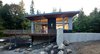The home seamlessly integrates a floating cedar tongue and groove roof with large sheltering overhangs, clerestory windows, and language of cedar slats for privacy screens and doors inside and out. Photo 6 of Cedar Haus modern home