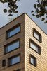 Modern home with Windows, Picture Window Type, and Metal. The building façade, designed by NAVA and handcrafted in Utah, is comprised of over 13,000 pieces of custom brass three dimensional tiles. It provides a modern-day façade yet contextual to its turn of the century surroundings. Photo 14 of 210 Pacific Street