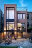 Modern home with Doors, Interior, Sliding Door Type, Metal, Vinyl, and Exterior. In contrast to the historically-preserved street facade, the rear facade was significantly opened up to create light-flooded spaces using Zola's Thermo Clad line with a more modern aesthetic. Photo of First Passive House Plus in the U.S.
