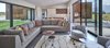 Modern home with Doors, Metal, Sliding Door Type, Exterior, Wood, and Interior. The clean and modern interior finishes–by local designer, Jacque Jenkins-Stireman–echo the home’s exterior architecture making it seem even more spacious. The kitchen cabinet doors, dining table, master bedroom furniture, custom built-in office desk and entryway bench are fabricated from a mixture of walnut, mimicking the same hue as the façade’s Douglas fir. The homeowners’ son-in-law, Alex Everett handcrafted many of the custom pieces. Photo 6 of House of Fir