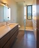 Modern home with Windows, Metal, Picture Window Type, and Wood. Stunning Teton Range views as seen from the master bath Thermo Clad window from Zola. Photo 4 of House of Fir