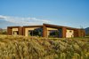 Modern home with Exterior, Wood Siding Material, and House Building Type. The rich dark-brown vertical Douglas fir exterior siding, from Montana Timber Products, melds into the native woody sage-brush tones and harmonizes with a lighter Cedar in intermittent horizontal bands around the house. Photo 13 of House of Fir