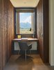 Modern home with Windows, Metal, and Wood. Custom built-in office desk are fabricated from a mixture of walnut, mimicking the same hue as the façade’s Douglas fir. The homeowners’ son-in-law, Alex Everett handcrafted many of the custom pieces. Photo 7 of House of Fir