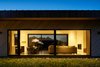 Modern home with Doors, Sliding Door Type, Interior, Exterior, Metal, and Wood. In the kitchen/living space, a 10ft. tall by 24ft. wide Lift & Slide door (FSC-certified Thermo Clad Pine) from Zola Windows brings the outside in. Photo 10 of House of Fir