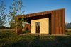 Modern home with Doors, Metal, Wood, Interior, Swing Door Type, and Exterior. The sloping winged walls have mitered corners and nails laid out in perfect dimensions. Photo 15 of House of Fir