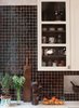 Modern home with Kitchen, Porcelain Tile Backsplashe, White Cabinet, and Drop In Sink. Hand-made Moroccan tile backsplash by Mosaic House with contrasting niche; custom kitchen cabinets designed by MIRIAM BIOLEK Interior Design with Bendheim's mouth-blown glass inserts. Photo of Harlem Brownstone