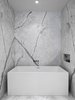 Soaking tub by Wet Style and custom stone niche at the Master Bathroom. Photo 15 of Telegraph Hill Periscope modern home